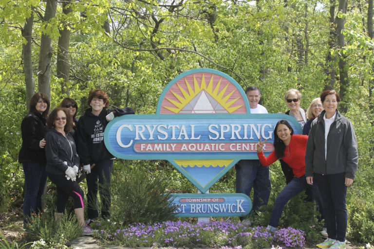 Coldwell Banker in East Brunswick beautifies Crystal Springs front entrance for Cares Day